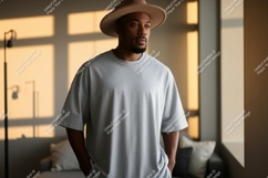 Man wearing grey t shirt and hat t-shirt fashion Product Image 1