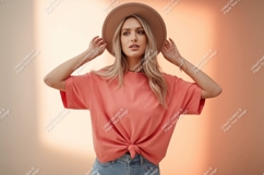Woman wearing coral t shirt and hat Product Image 1