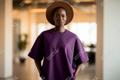 Woman wearing purple t shirt and brown hat image Product Image 1