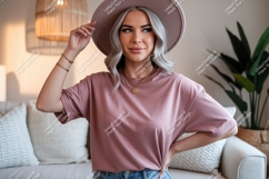 Woman wearing dusty rose t shirt and hat image Product Image 1