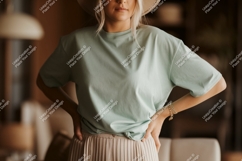 Woman wearing mint green t shirt and beige skirt image Product Image 1