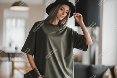 Woman wearing olive green t-shirt and black hat image Product Image 1