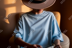 Woman wearing light blue t shirt and hat image Product Image 1
