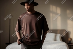 Man wearing brown shirt black hat image Product Image 1