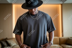 Woman wearing grey t shirt and hat image Product Image 1