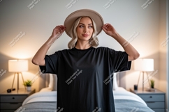 Woman wearing black t shirt and hat image Product Image 1