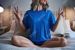 Woman wearing blue t shirt peace sign t-shirt Product Image 1