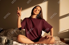 Woman wearing maroon t-shirt peace sign image Product Image 1