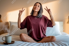 Woman relaxed peace gesture on bed with coffee Product Image 1