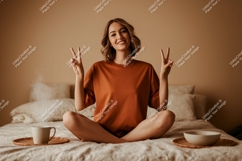 Woman peace gesture on bed with coffee image Product Image 1