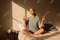 Woman peace gesture morning light image Product Image 1