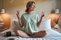 Woman peace sign gesture on bed green Product Image 1