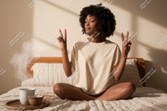 Woman peace gesture in bed meditation Product Image 1