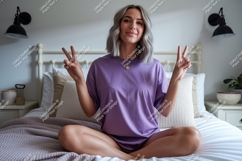 Woman wearing purple t shirt peace sign image Product Image 1