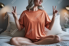 Woman peace gesture orange shirt image Product Image 1