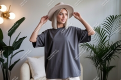 Woman wearing grey t-shirt and hat fashion Product Image 1