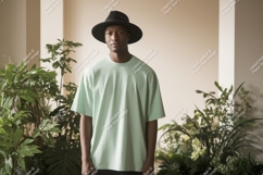 Man wearing mint t shirt and black hat image Product Image 1