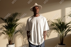 Man wearing white t-shirt and hat plants Product Image 1