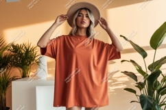 Woman wearing terracotta oversized t shirt and hat Product Image 1