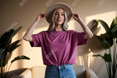 Woman wearing pink t shirt and hat image Product Image 1