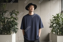 Man wearing dark blue t shirt and black hat image Product Image 1