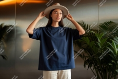 Woman wearing plain dark blue t shirt and hat Product Image 1