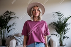 Blonde woman wearing pink t-shirt and hat Product Image 1