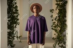 Man wearing purple t shirt and hat image Product Image 1