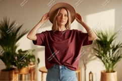Woman Wearing Maroon T Shirt And Hat Product Image 1