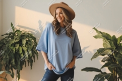 Woman wearing blue t shirt and hat image Product Image 1