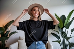 Blonde Woman Wearing Black T Shirt And Hat Product Image 1