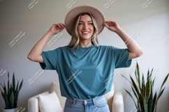 Woman wearing teal t shirt and hat image Product Image 1