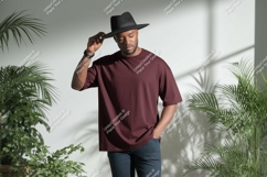 Man wearing maroon t shirt and black hat t-shirt Product Image 1