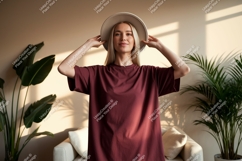 Woman wearing maroon t shirt and hat image Product Image 1