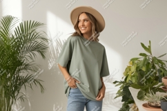 Woman wearing green t shirt and hat image Product Image 1