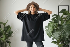 Woman wearing black t shirt and hat image Product Image 1