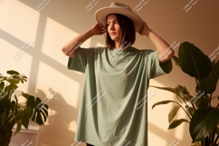 Woman wearing light green t shirt and hat image Product Image 1