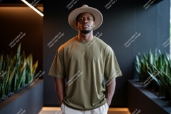 Man wearing olive green t shirt and hat image Product Image 1
