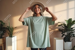 Woman wearing green t shirt and hat image Product Image 1
