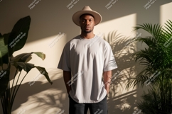 Man wearing light grey t shirt and hat t-shirt Product Image 1