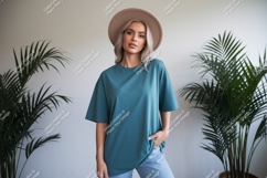 Woman wearing teal t shirt and hat image Product Image 1