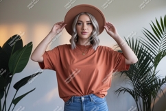 Woman wearing terracotta t shirt and hat image Product Image 1