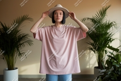 Woman wearing pink t shirt and hat image Product Image 1