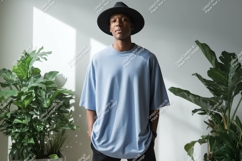 Man wearing blue t shirt and black hat image Product Image 1