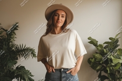 Woman wearing neutral t-shirt and hat Product Image 1