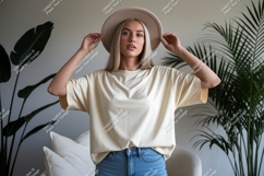 Woman wearing cream t shirt and hat image Product Image 1