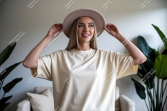 Blonde woman wearing cream t shirt and hat image Product Image 1