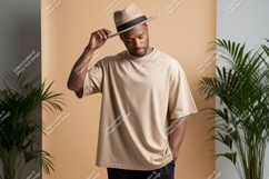 Man wearing beige t shirt and hat image Product Image 1