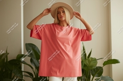Woman wearing coral t shirt and hat image Product Image 1
