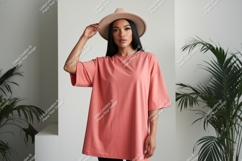 Woman wearing coral oversized t shirt and hat t-shirt Product Image 1